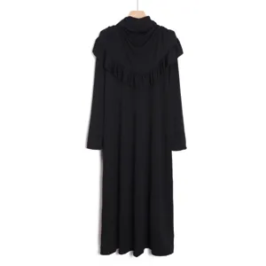 Detailed view of this elegant black long-sleeve maxi dress with draped hijab and ruffles.