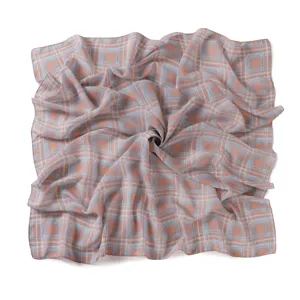 Detailed view of a soft pink and blue plaid chiffon square scarf, elegant draped fabric.