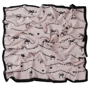 Chiffon square scarf featuring cute black bows, hearts, and dotted lines on soft pink base.