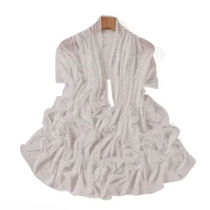 Detailed view of the sheer mesh fabric with sparkling rhinestones, lightweight accessory.