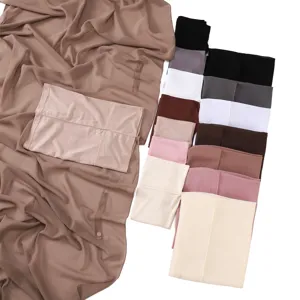Detailed view of solid color chiffon hijab scarf matching cap and magnetic button set colors.
