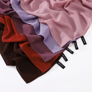 Detailed view of multi-color chiffon scarves, showing soft fabric texture and neat stitching.