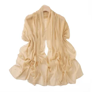 Elegant shimmering champagne chiffon shawl scarf with faux pearls and metallic silver threads.