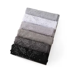 Detailed view of glamorous rhinestone-embellished shimmer chiffon scarf set in assorted neutral colors.