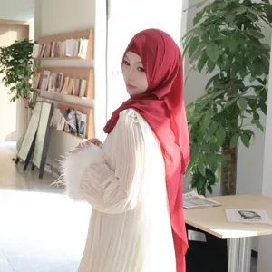 Solid chiffon hijab scarf set with elegant pleated long dress and chic feather cuffs detail.