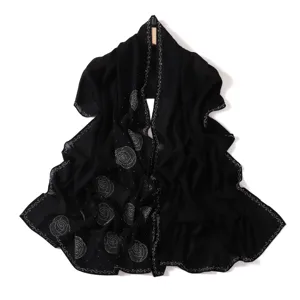 Black chiffon hijab scarf featuring sparkling rhinestone rose pattern and beaded edges detail.