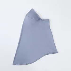 Milk silk solid color hijab detail close up showing smooth texture and stitching.