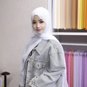 Detailed shot of a solid color chiffon long hijab set with inner cap and magnetic buckle.