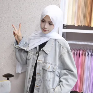 Detail shot showing the texture of the solid chiffon hijab and inner cap paired together.