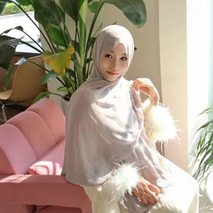 Elegant grey chiffon hijab set with feather cuffs detail for graceful modest fashion look.