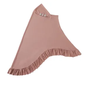 Dusty pink crystal linen hijab detail with sparkling rhinestone trim and ruffled hem.