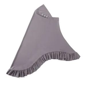 Solid grey slip-on hijab featuring elegant rhinestone bows and ruffled hem for stylish modest wear.