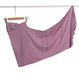 Solid color headscarf with metal camellia and rhinestone tassel chains for elegant wear.