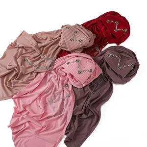 Elegant pleated Muslim hijab with rhinestone camellia and tassel chain. Comfortable daily wear.