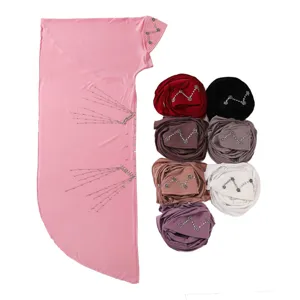 Comfortable solid color Muslim hijab with rhinestone tassel chains and floral camellia details.