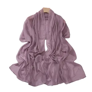 Purple pleated chiffon shawl detail, featuring sparkling silver threads and elegant pearl beading.