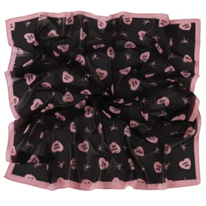 Detailed view of the preppy style bow and heart print chiffon square scarf fabric texture.