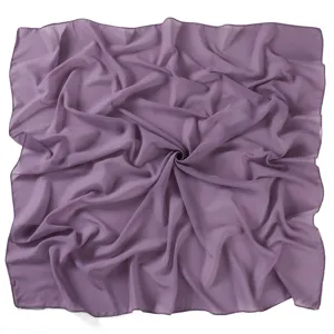 Close-up detail of the purple chiffon square scarf showing fabric texture and swirl fold.