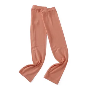 Close-up detail of solid color modal sun protection cooling arm sleeves in light pink.