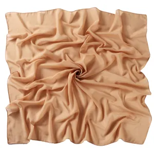 Solid color chiffon square scarf detail view, elegant drape and soft lightweight fabric.