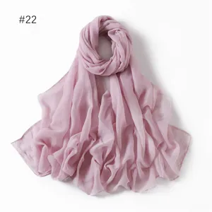 Solid pink lightweight voile polyester long scarf detail showing soft texture and fine fabric.