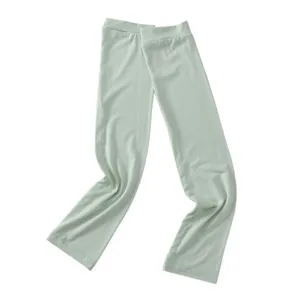 Close-up detail of soft modal sun protection arm sleeves in light green, breathable fabric.