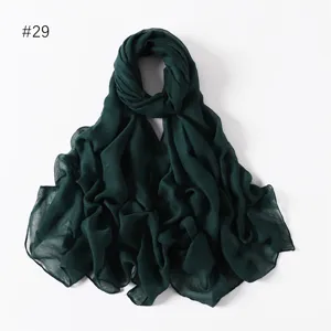 Dark green lightweight solid sheer voile long scarf detail view showcasing fine texture.