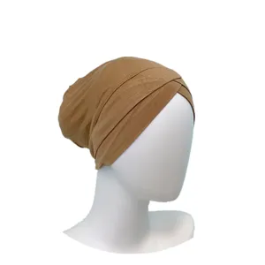 Detail closeup view of the soft modal cross turban cap inner hijab in khaki color.
