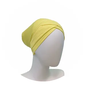 Yellow modal cross hijab cap inner detail view showing the soft fabric and pleated design.