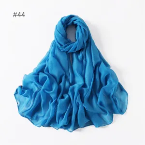 Lightweight solid blue long scarf, versatile travel photo shawl and stylish accessory.