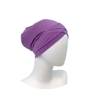 Close-up detail view of the purple modal cross inner hijab cap, showing soft fabric texture.