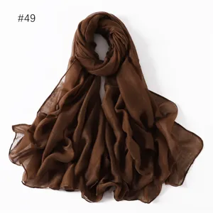 Detailed view of solid brown polyester voile long scarf, lightweight and breathable.
