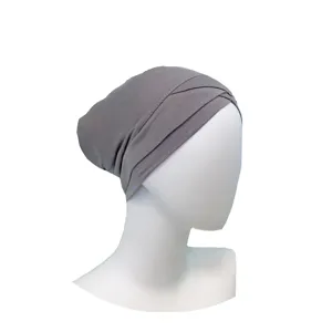 Detailed view of the grey modal cross turban inner cap, showing soft fabric and pleated design.