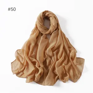 Detailed view of the lightweight solid color polyester voile long scarf in a chic khaki tone.