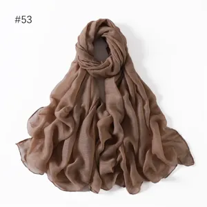 Detailed view of the solid brown lightweight polyester voile long scarf and elegant shawl.
