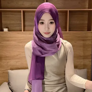 Details of the luxury purple gradient satin headscarf, showing smooth shimmering texture.