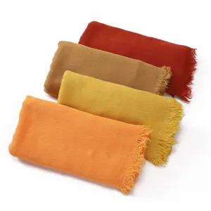Detail view of the soft rayon pleated scarf with fringe, showing texture and multi-color options.