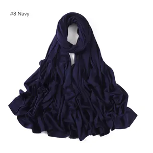 Navy blue modal jersey hijab fabric detail, soft stretchy material texture close up.