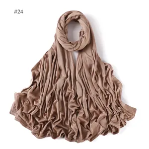 Detailed view of a soft modal jersey long scarf in solid light brown, skin-friendly hijab.