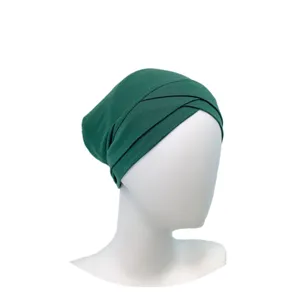 Dark green modal cross hijab inner cap detail view, comfortable stretch Muslim underscarf.