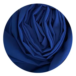 Dark blue chiffon fabric texture detail, soft material with elegant draped folds.