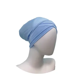 Light blue modal cross hijab cap detail, soft inner cap textile texture and side fold display.
