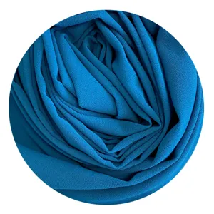 Blue chiffon hijab fabric detail closeup, soft texture solid color swatch for women