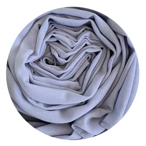 Close-up detail of soft pastel purple chiffon hijab fabric, elegant texture and smooth touch.