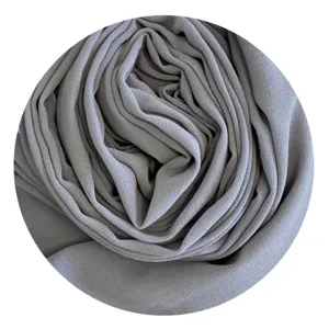 Detailed view of the solid grey chiffon hijab showing delicate fabric texture and folds.