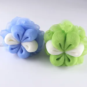 Detailed view of dual-color petal shaped mesh bath sponges for gentle daily body cleansing.