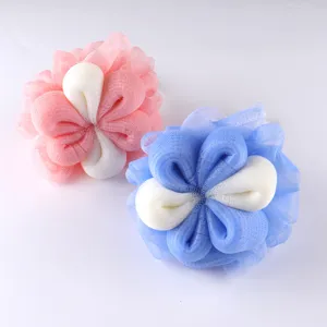 Explore close-up details of this cute plum blossom bath sponge, designed for rich foaming.