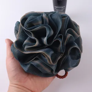 Rose bath sponge detail view, soft mesh shower puff with gradient color and hanging rope for daily use.