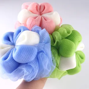 Close-up details of colorful mesh bath sponges, soft texture and rich foaming for daily shower use.