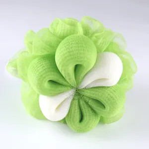 Close-up detail of green and white mesh bath sponge, soft foaming net texture for daily shower use.